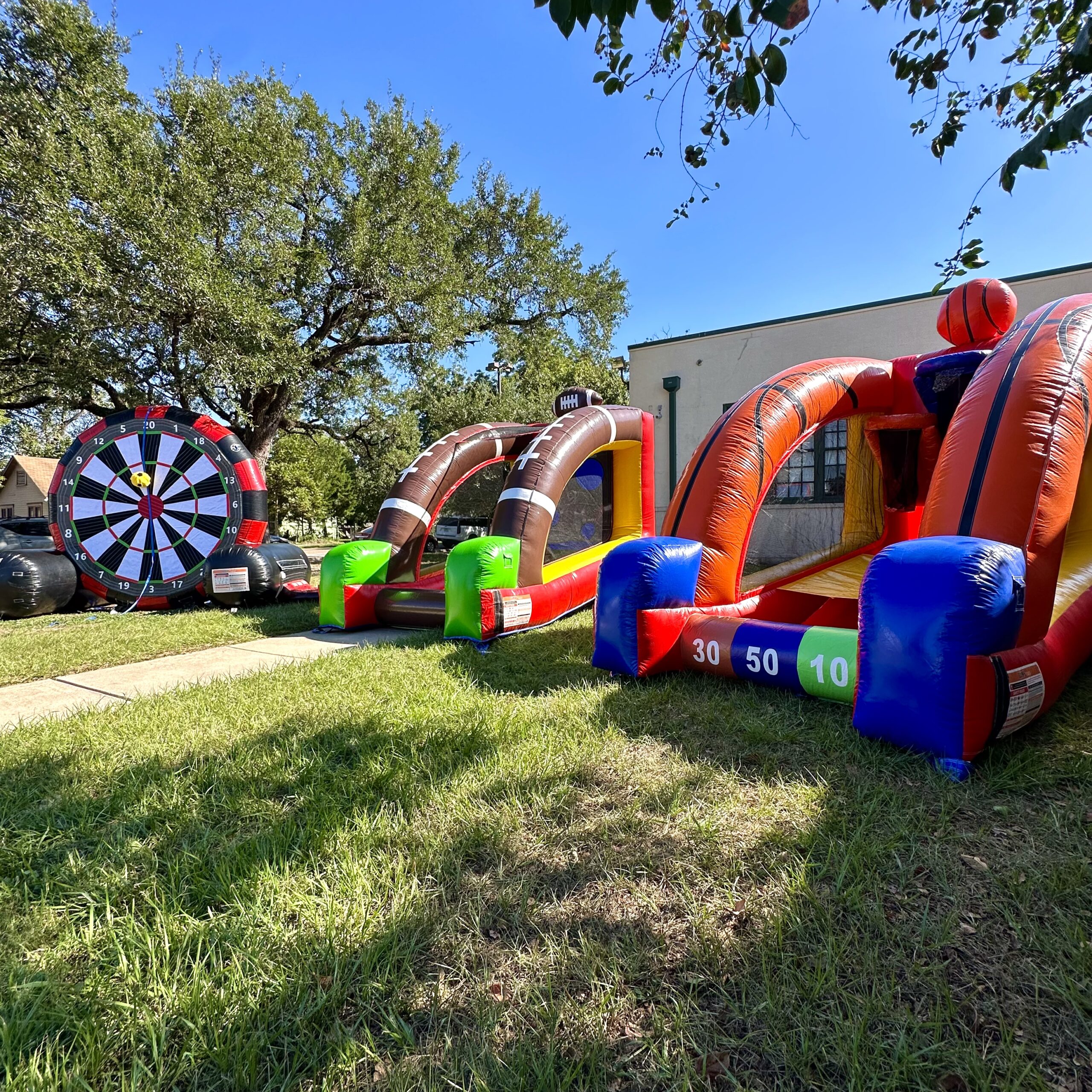 Inflatable interactive games set up for an outdoor event in Houston